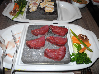 Beef cooking on a volcanic stone, Izumi restaurant, Legend of the Seas