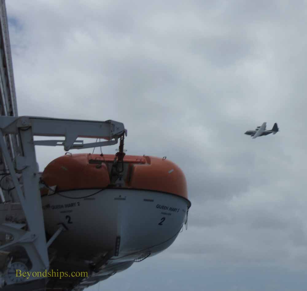Canadian C-130 over Queen Mary 2 during rescue of yachtsman